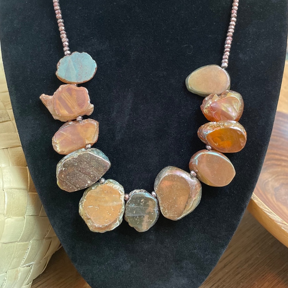 Lovely sliced agate necklace with copper heshi. 18 inches long.